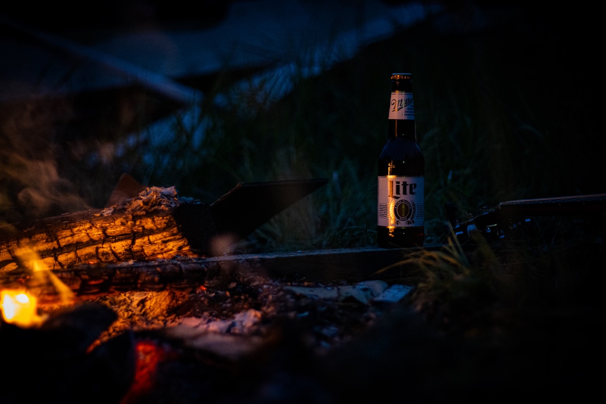 Lite bottle next to fire pit