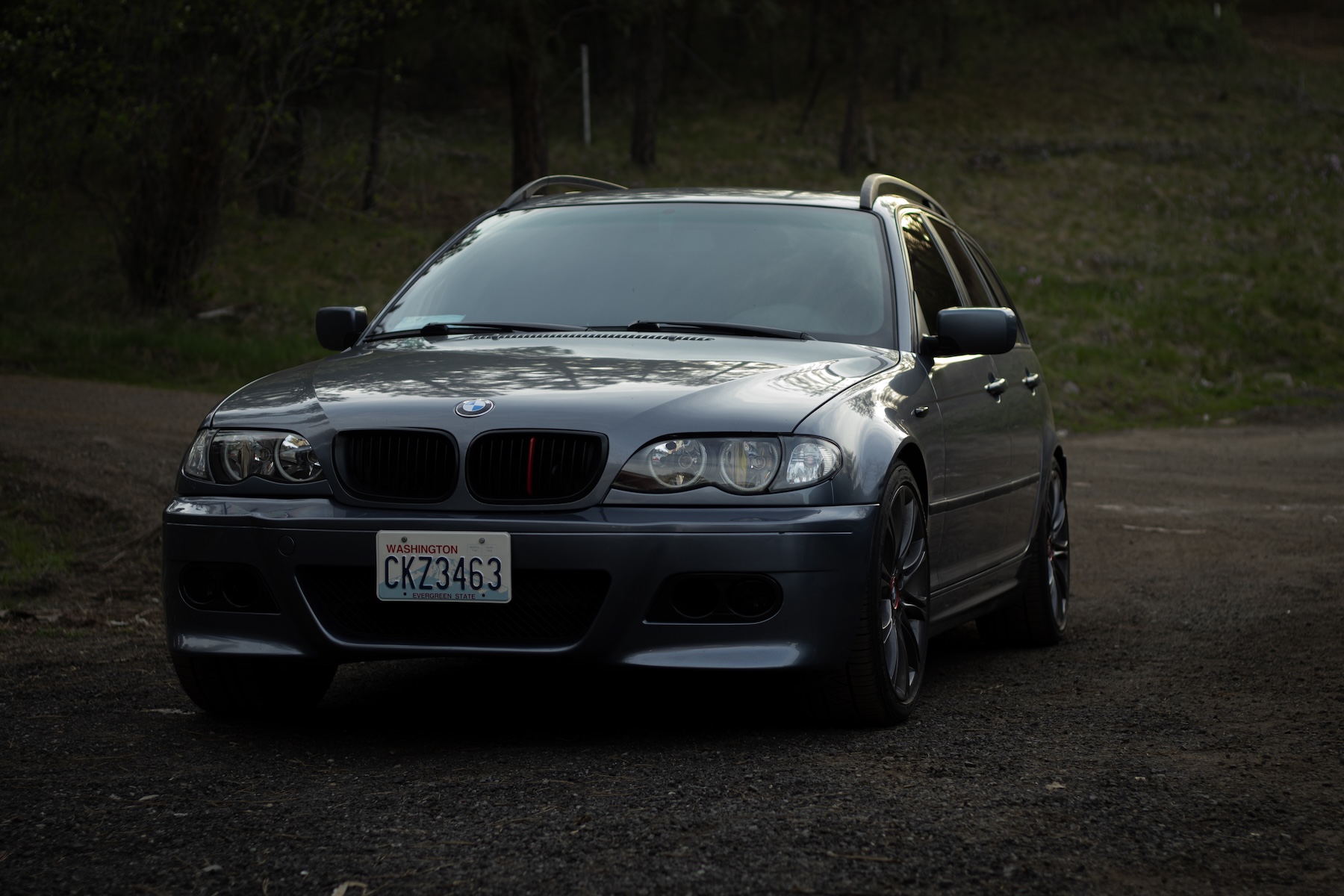 BMW E46 front angle with visible gravel ground