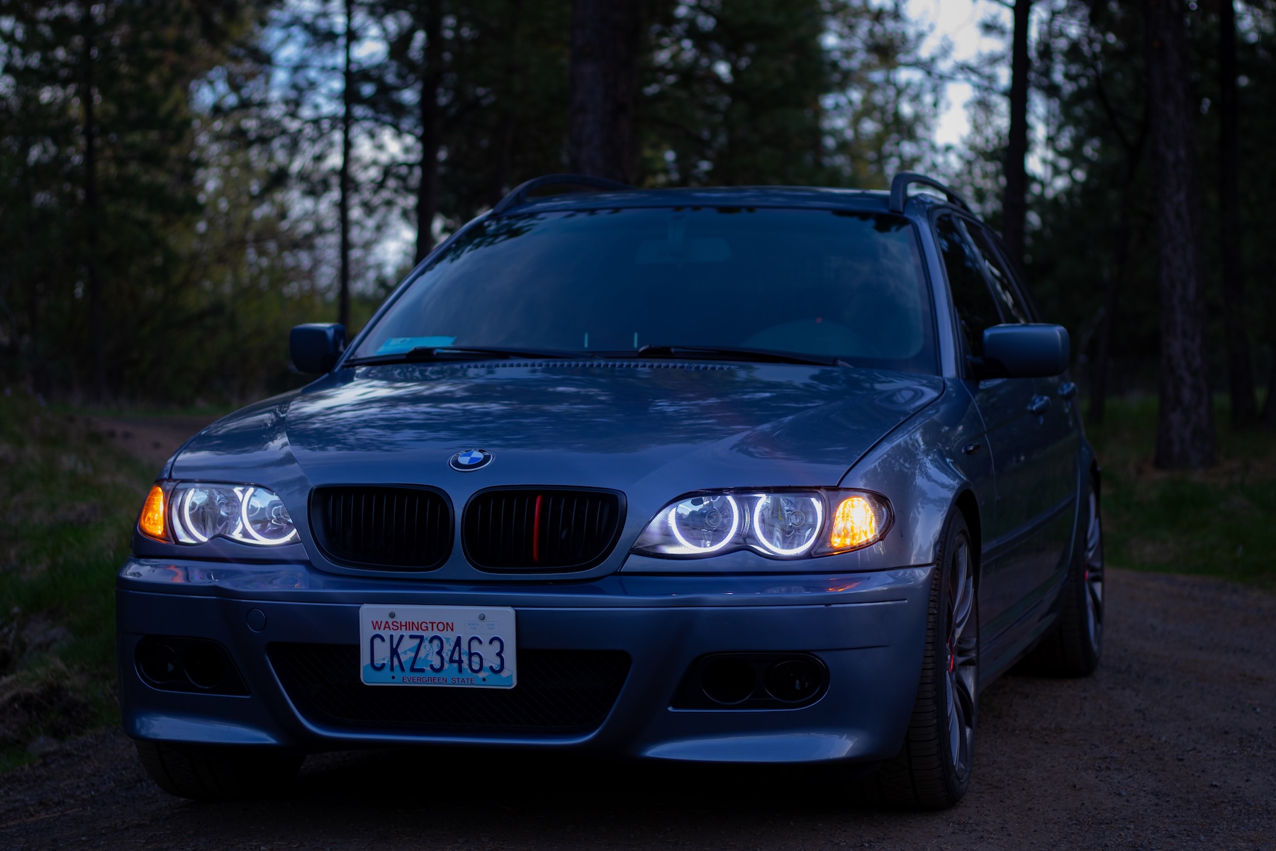 BMW E46 with orange and white halos glowing